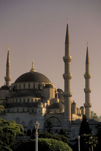 View of buildings in city against clear sky