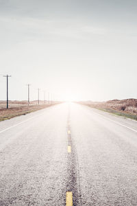 Road amidst landscape against sky