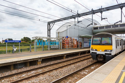 Train on railroad station platform against sky