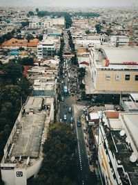 High angle view of street amidst buildings in city