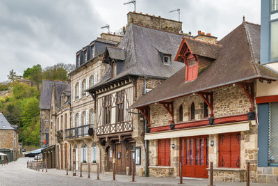 Street with half-timbered houses in dinan city center, brittany, france