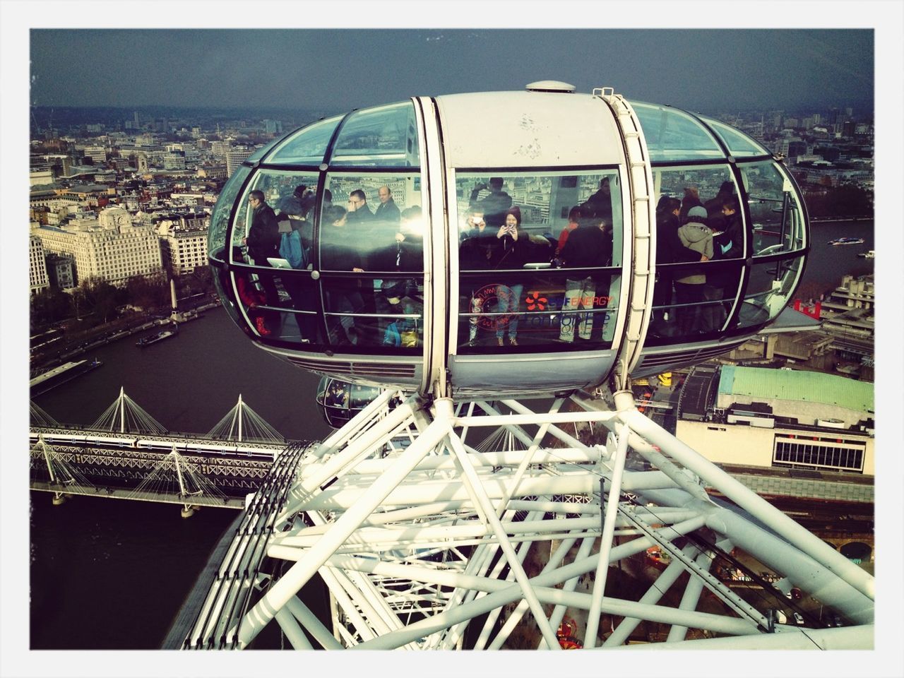 transfer print, auto post production filter, architecture, built structure, building exterior, amusement park, ferris wheel, city, amusement park ride, metal, sky, arts culture and entertainment, glass - material, indoors, day, circle, travel, travel destinations, reflection