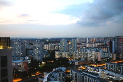 High angle view of illuminated buildings in city against sky