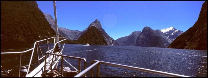 Scenic view of mountains against clear blue sky