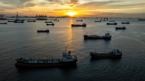 Boats moored at harbor