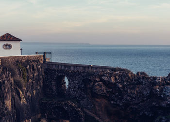 Whitewashed house at boca do inferno in cascais, portugal coast of atlantic ocean