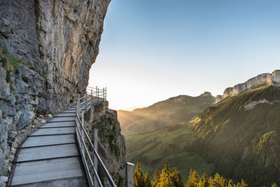 Scenic view of mountains against sky seen from boardwalk