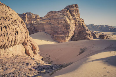 Scenic view of desert against clear sky