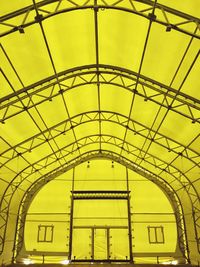 Low angle view of yellow ceiling