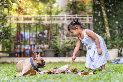 Girl with dog on grass