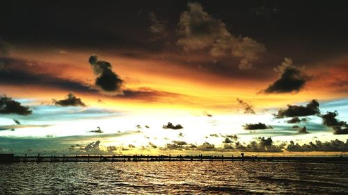 Scenic view of sea against dramatic sky