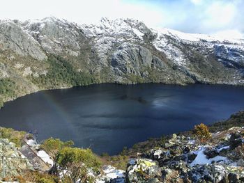 Scenic view of lake against sky during winter