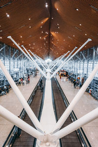 High angle view of people on escalator in city