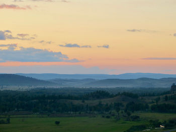 Scenic view of landscape against sky during sunset