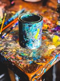 High angle view of various paint on table