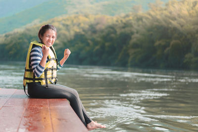 Woman sitting in lake