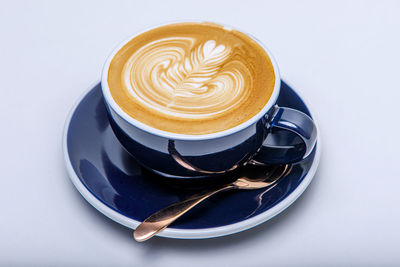 Close-up of cappuccino on table