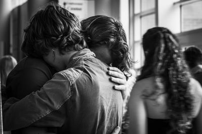 Close-up of siblings hugging