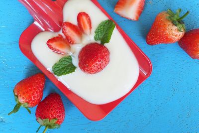 High angle view of strawberries in plate on table