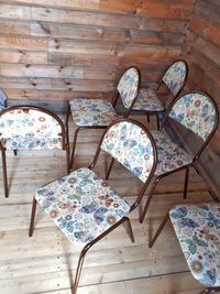 High angle view of empty chairs on table