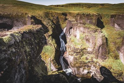 High angle view of river flowing through rock formations