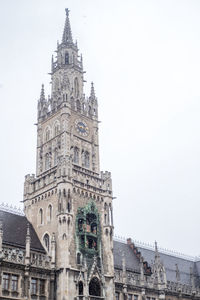 Low angle view of clock tower against sky