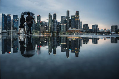 Reflection of buildings on water in city