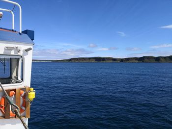 Scenic view of sea against blue sky