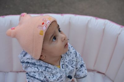 High angle view of cute girl looking down