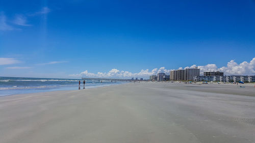 View of beach against blue sky