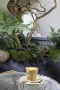 Close-up of coffee cup on table