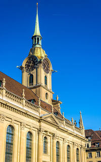 Low angle view of building against blue sky