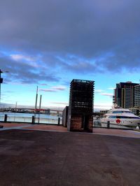 Buildings against cloudy sky