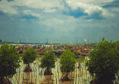 High angle view of trees and buildings against sky