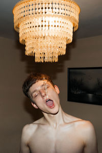 Portrait of shirtless man at home