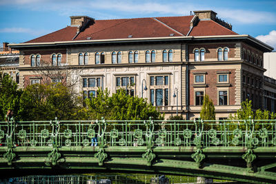 View of old building against sky with bridge