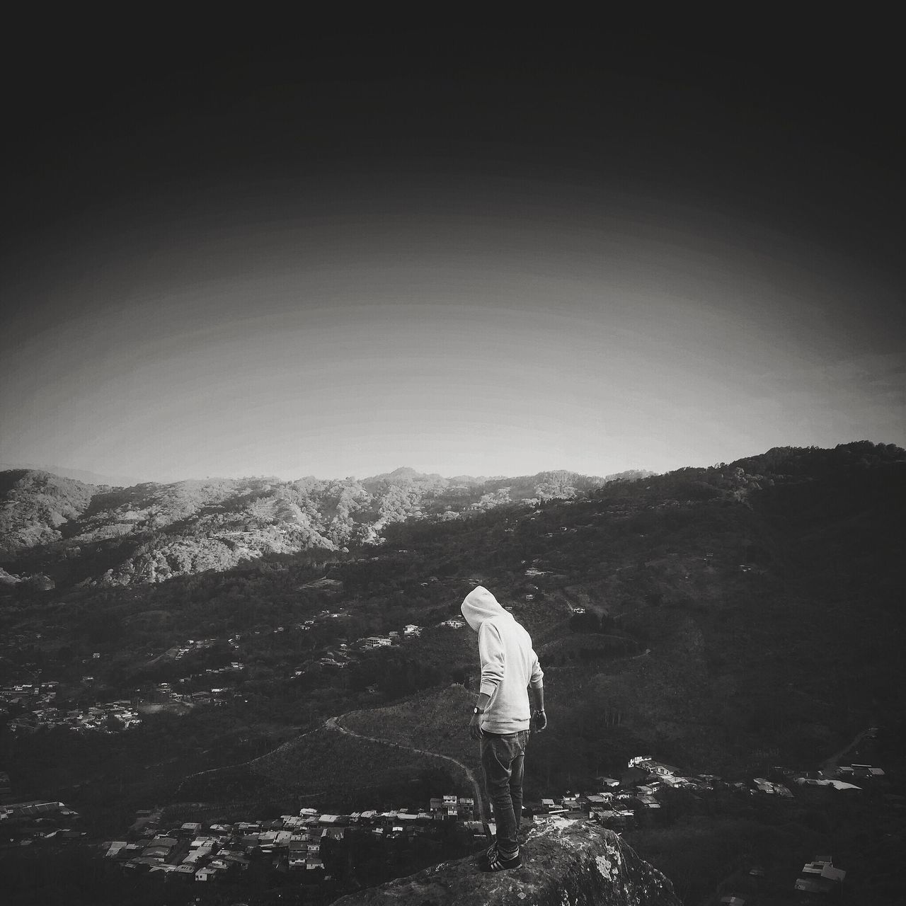 mountain, clear sky, copy space, tranquil scene, tranquility, landscape, scenics, nature, beauty in nature, tree, mountain range, non-urban scene, full length, day, outdoors, hill, rear view, sky, idyllic, one person