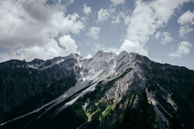 Scenic view of snow covered mountains against sky