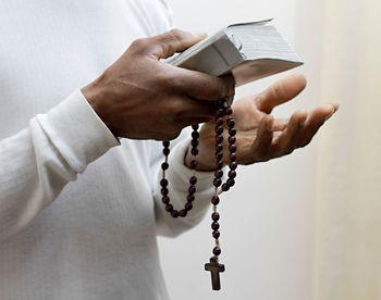 Praying to god for forgiveness caribbean man praying  with people stock image stock photo