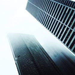 Low angle view of skyscrapers against clear sky