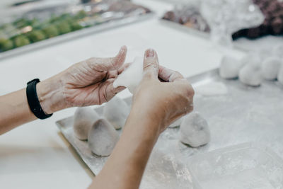 High angle view of woman hand with water