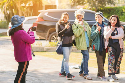 Rear view of people walking outdoors