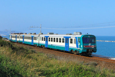 Train on railroad track against sky