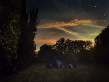 Scenic view of field against sky at night