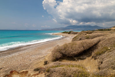 Gravel / pebble beach at the westcoast of rhodes island near kattavia with ocean waves