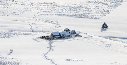 Scenic view of snow covered land