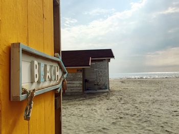 Built structure on beach against sky