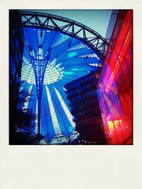 Low angle view of ferris wheel against sky