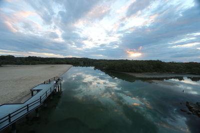 Scenic view of river against sky during sunset