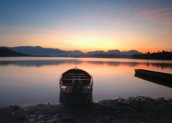 Scenic view of lake against sky during sunset